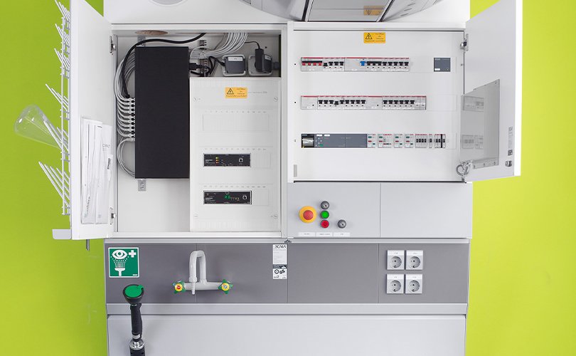 Integrated lab supply unit with water tap and switches