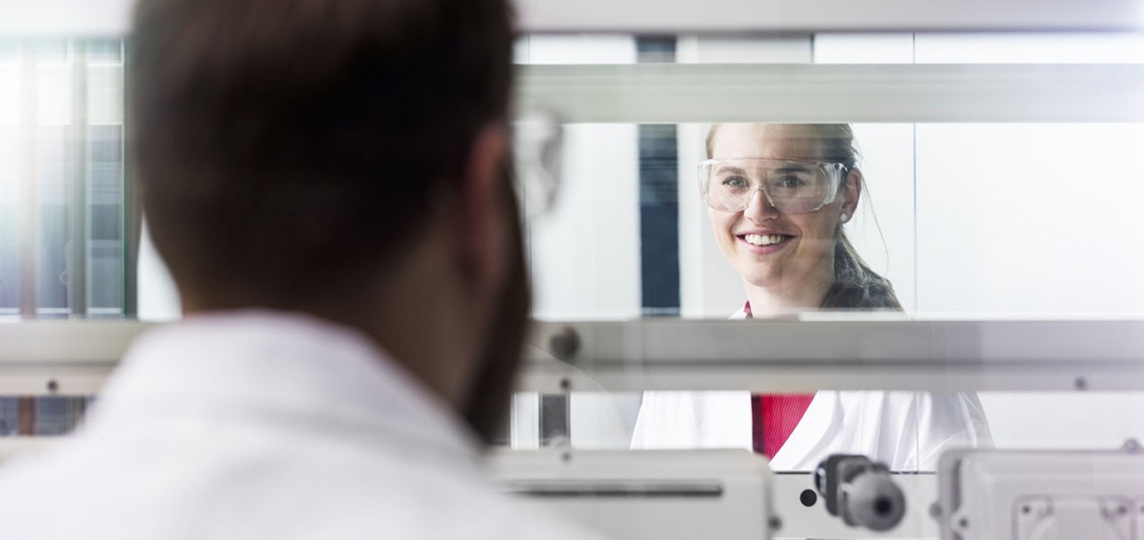 Lab technicians at the fume hood