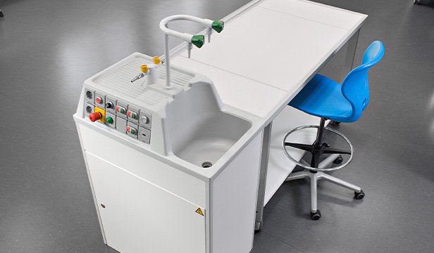 Laboratory workstation with integrated sink, gas supply and control elements
