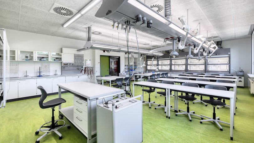 Laboratory room with modern equipment and microscopes
