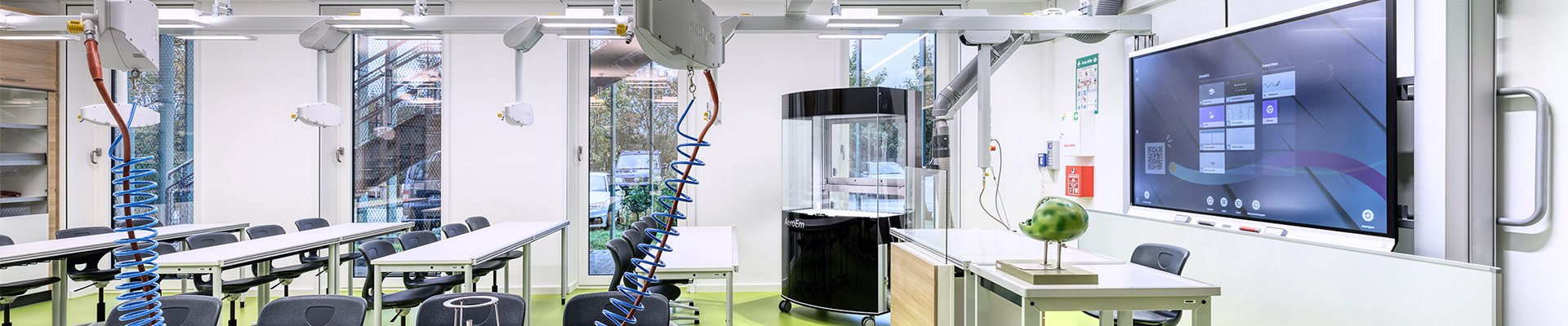Modern science classroom with digital board and lab setups