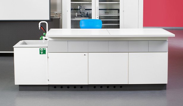 Front view of an experimental table with integrated sink and service units