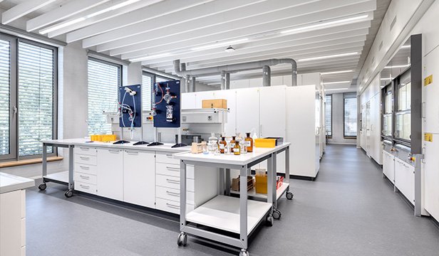 Students preparing experiments in a modern makerspace environment