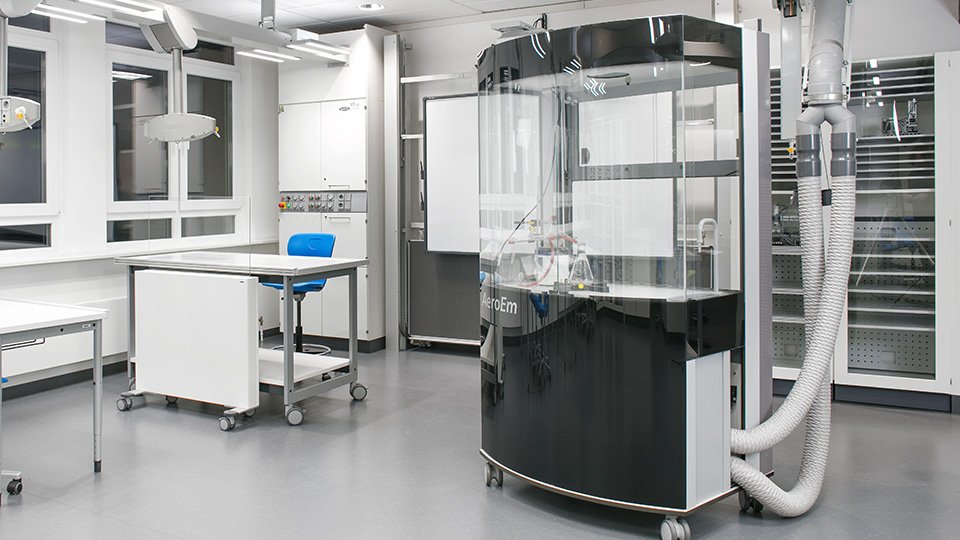 The AeroEm, a round central lab device with tubes and glass elements