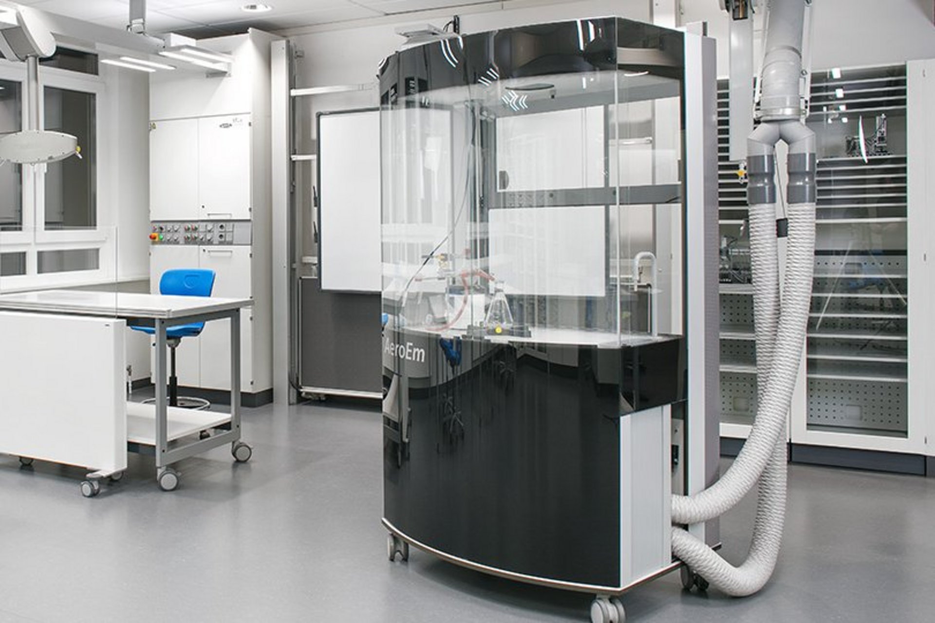 The AeroEm, a round central lab device with tubes and glass elements