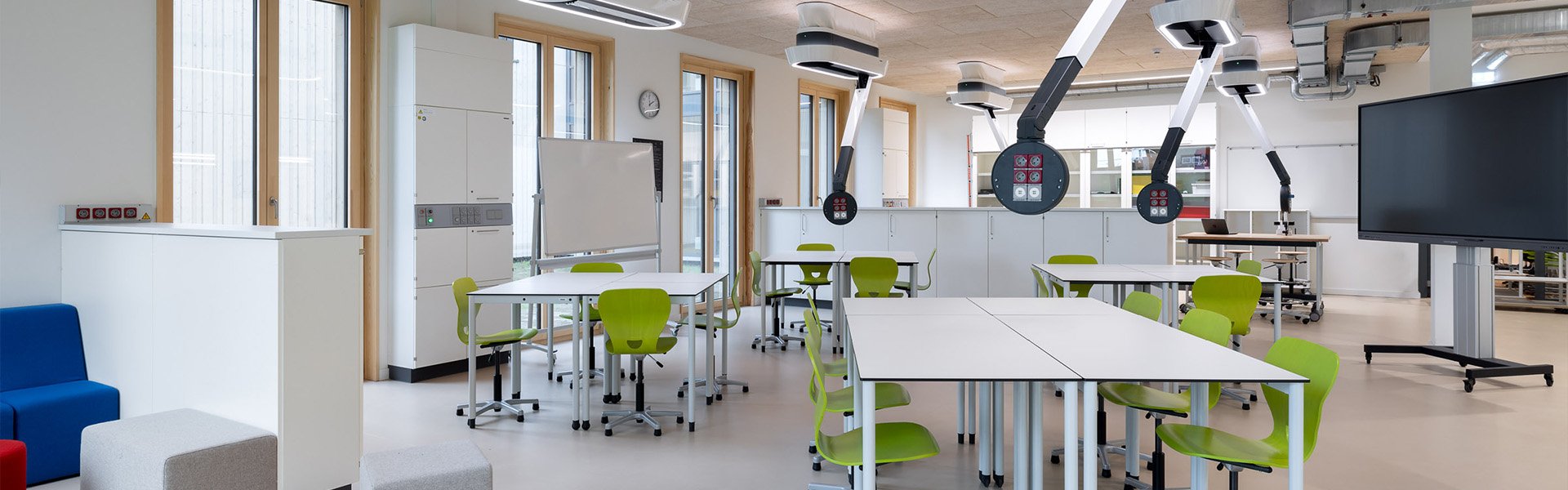 Modern open workspace with seating and presentation board