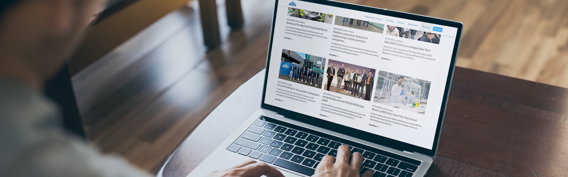 Person scrolls through Waldner's news on the laptop