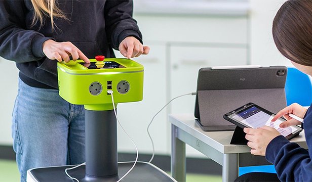 Person connecting tablet to mediaBuddy device