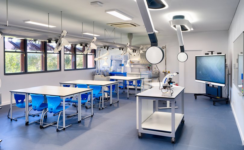 Spacious, well-equipped science classroom with ceiling service units
