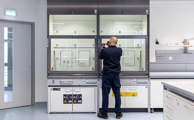 Laboratory personnel at fume hood