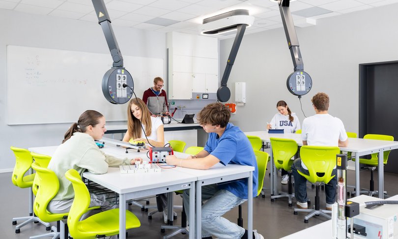 Students working on projects in a modern classroom environment